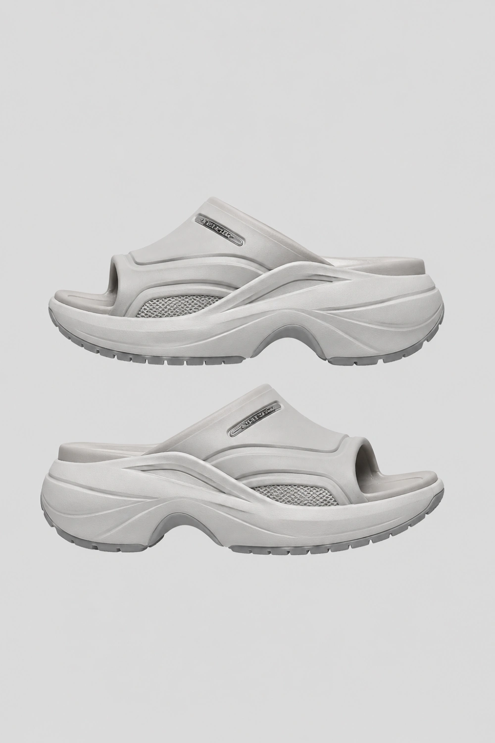 Sporty chunky platform mule slides in sleek gray color with futuristic cushioned sole, oversized modern silhouette, athleisure fashion aesthetic, trendy Pinterest sporty mule sandals for comfortable streetwear looks.