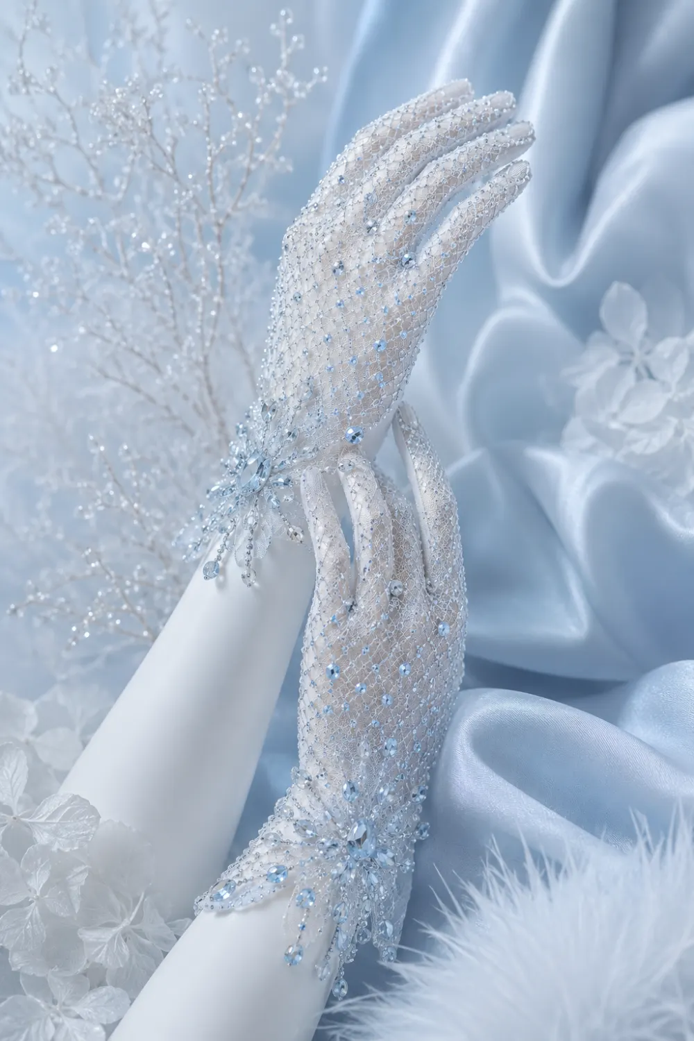 Elegant ice blue crystal mesh gloves with sparkling rhinestone details and luxurious frozen glam styling inspired by couture winter fashion trends for 2026.
