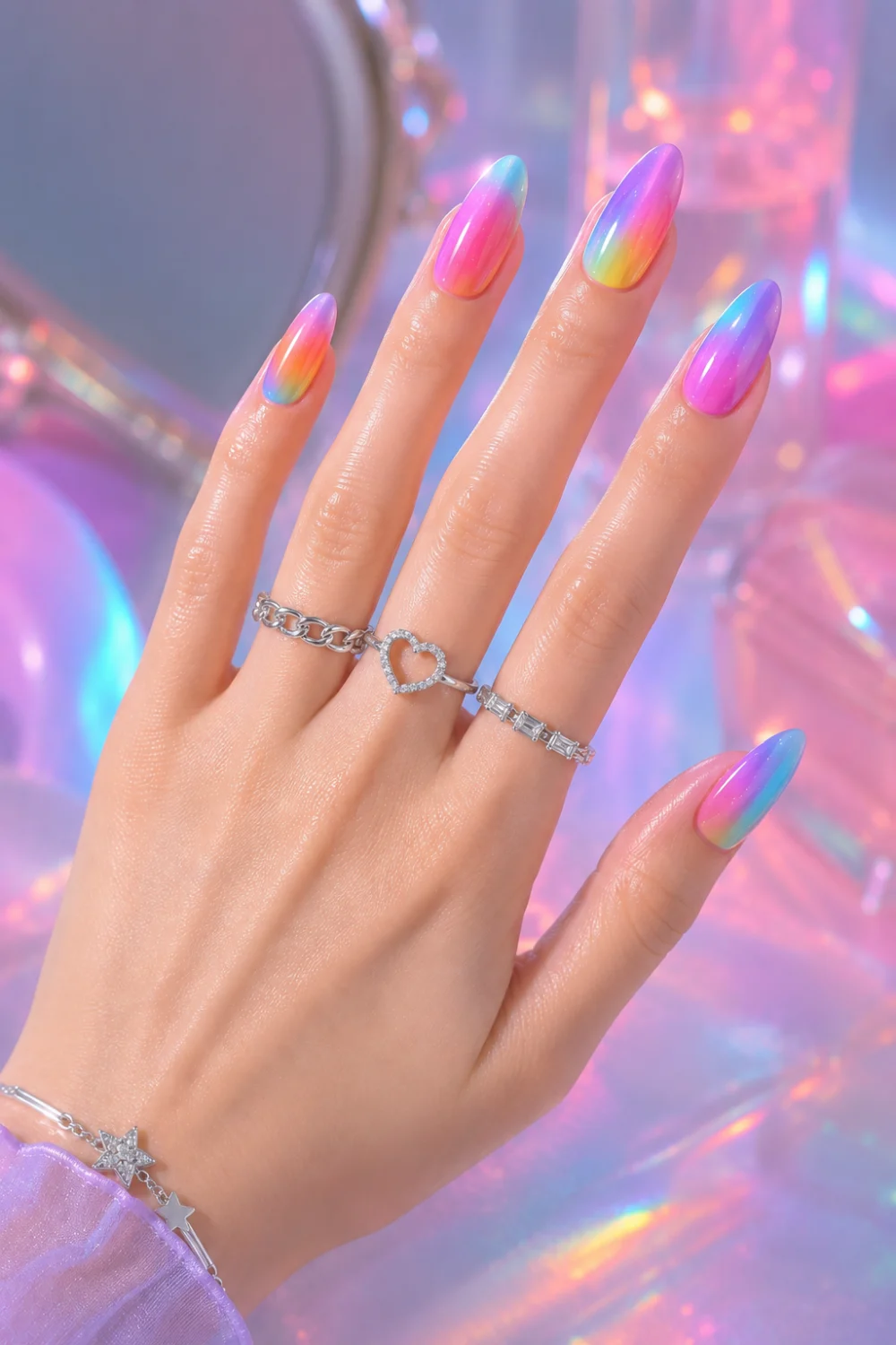 Rainbow airbrush ombre nails with colorful pastel gradient on glossy almond nails, featuring holographic Y2K-inspired manicure styling and vibrant summer nail trends for 2026.