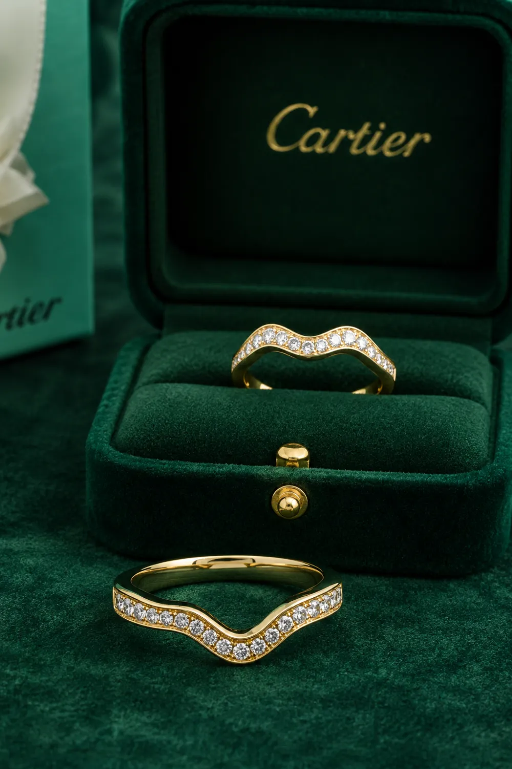 Wave contour wedding band featuring curved gold design with sparkling diamond accents, luxury velvet jewelry box, elegant bridal ring styling, modern wedding band inspiration for brides.